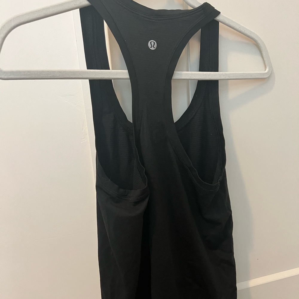 Lulu lemon swiftly tank top. Size 4 (small) color black.
